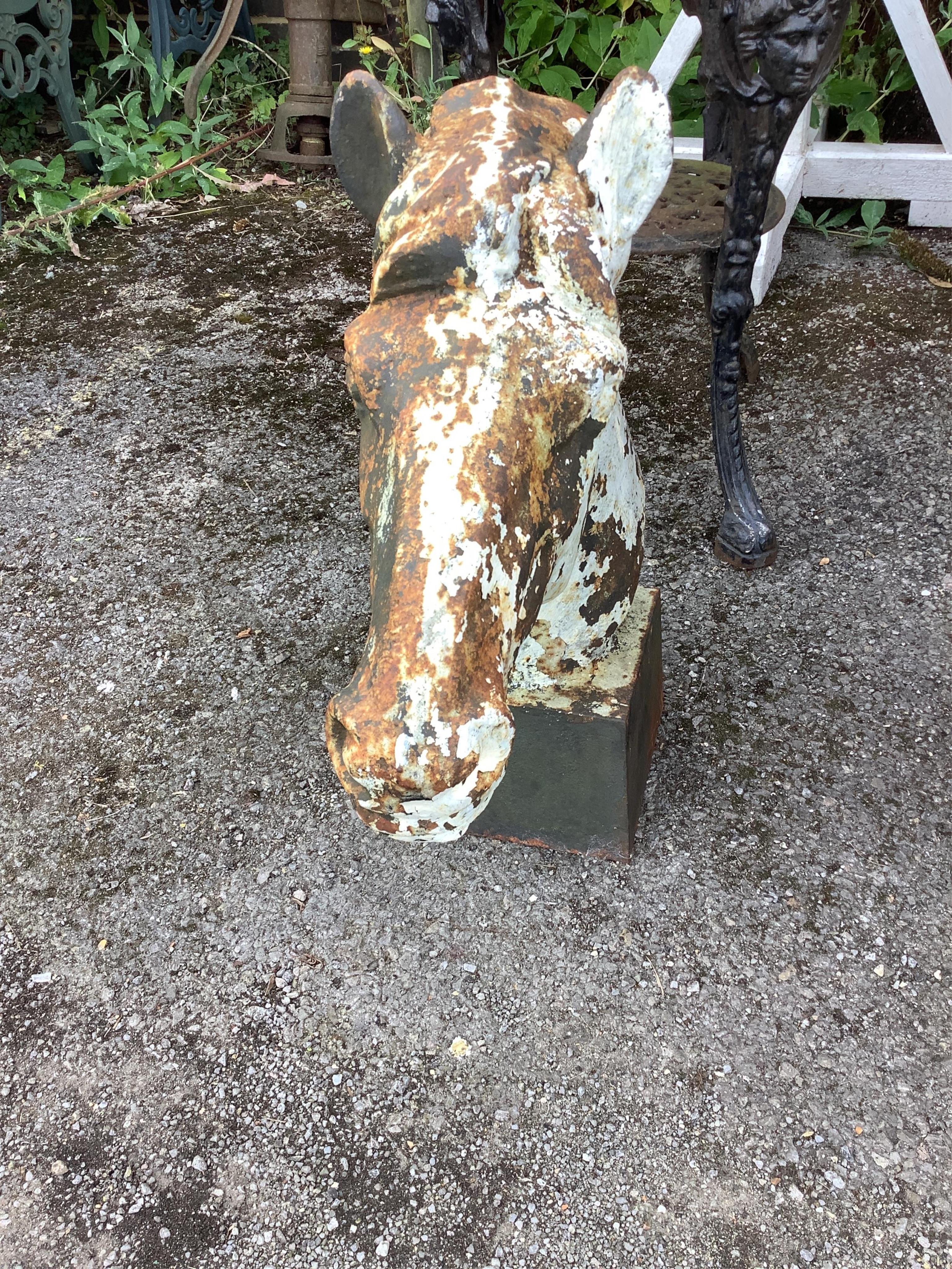 A cast iron horse head finial garden ornament, height 60cm. Condition - fair